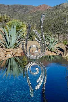 Stainless steel sculpture in pool